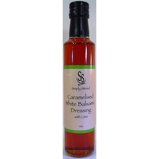 Bottle of Simply Stirred Caramelised White Balsamic Dressing with Lime on a white background