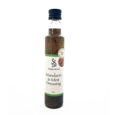 Bottle of Mandarin & Mint Dressing with a white label on a white background